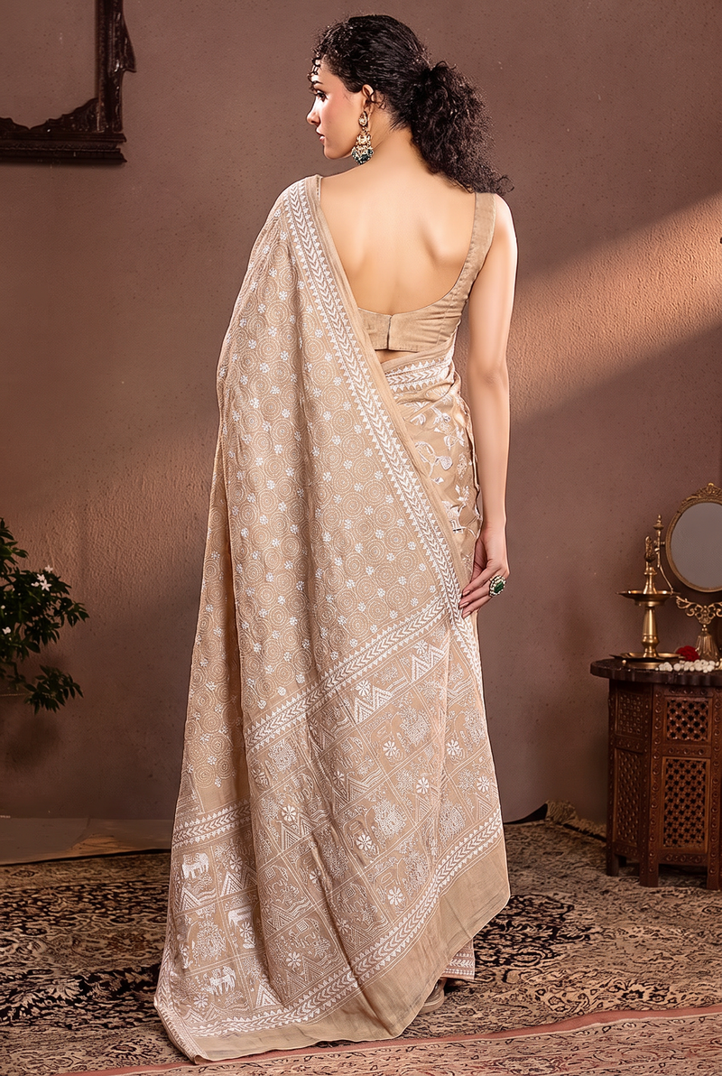White thread on ivory silk, like moonlight in a garden. Birds, branches and blossoms bloom in hand-stitched silence across soft Gachi Tussar.