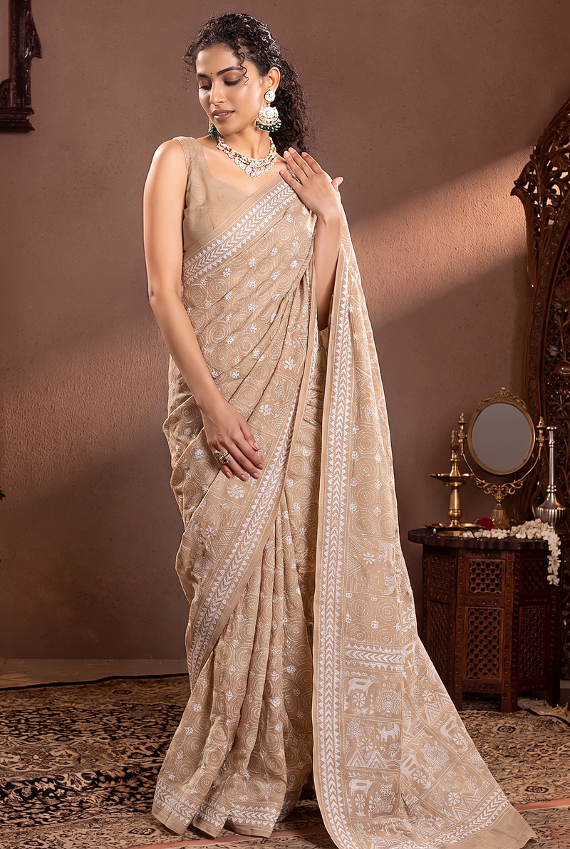 White thread on ivory silk, like moonlight in a garden. Birds, branches and blossoms bloom in hand-stitched silence across soft Gachi Tussar.