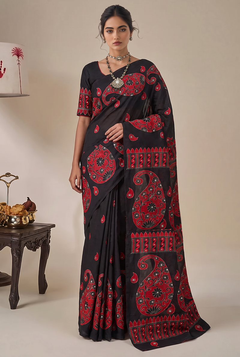 Midnight silk, crimson thread, women's hands. Kantha from Bolpur.