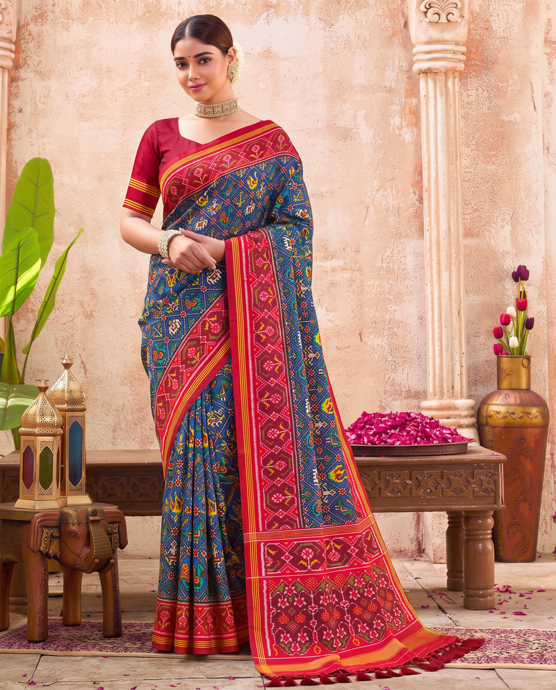 Royal blue, a miniature parade of elephants and peacocks, a red and gold farewell. Handloom Rajkot Patola from Gujarat.