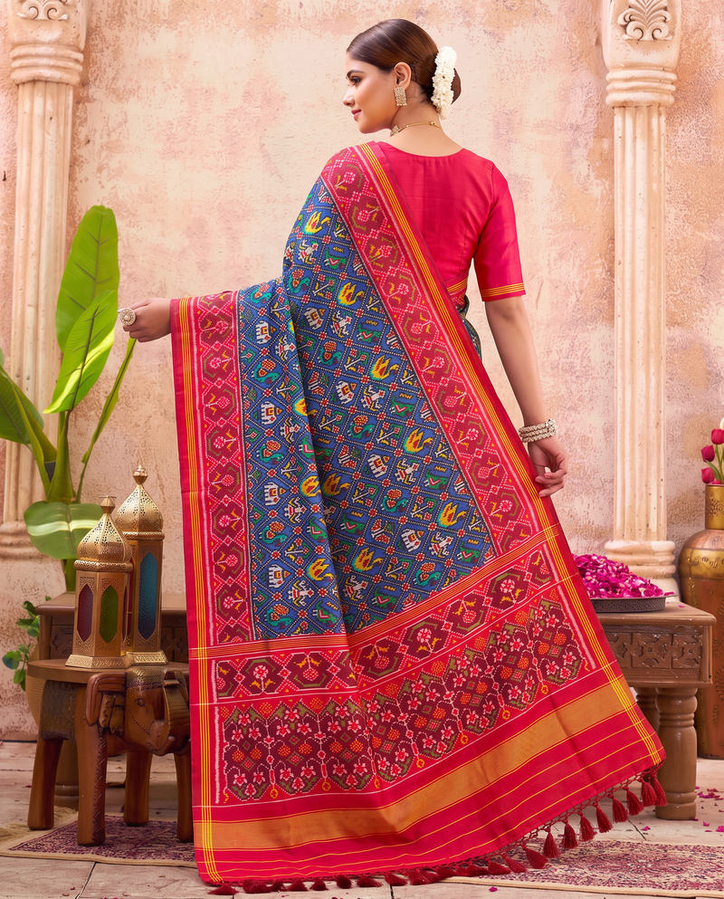 Royal blue, a miniature parade of elephants and peacocks, a red and gold farewell. Handloom Rajkot Patola from Gujarat.