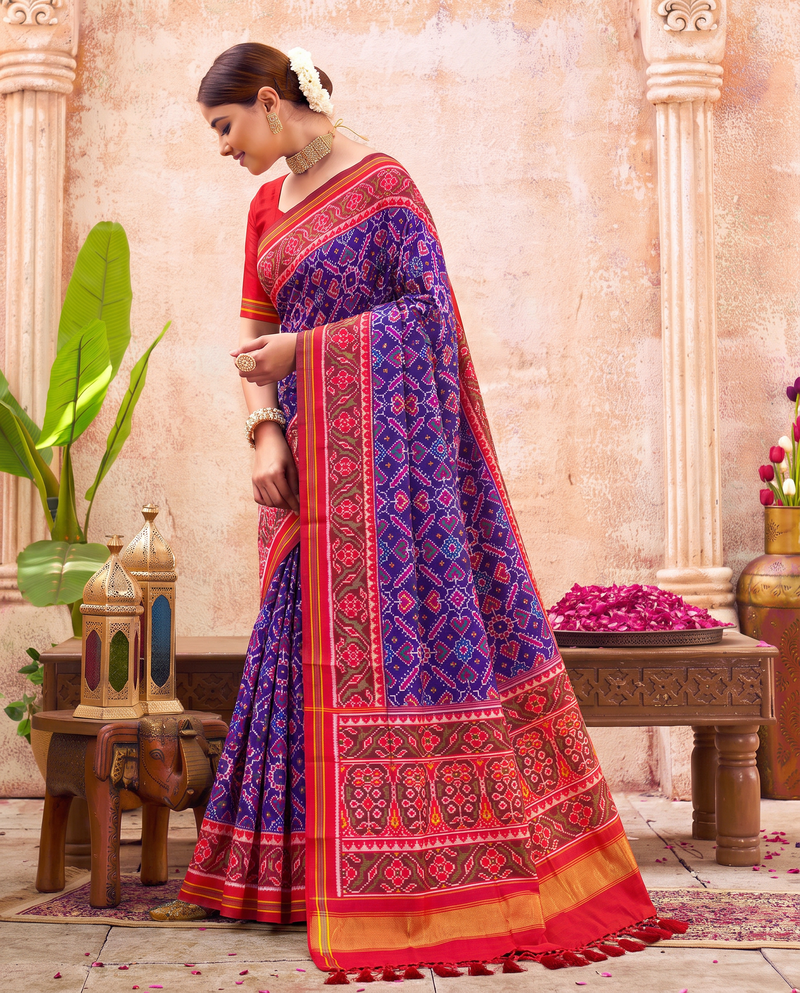 Indigo hearts and diamonds, a doorway of torans, a golden welcome. Handloom Rajkot Patola from Gujarat.