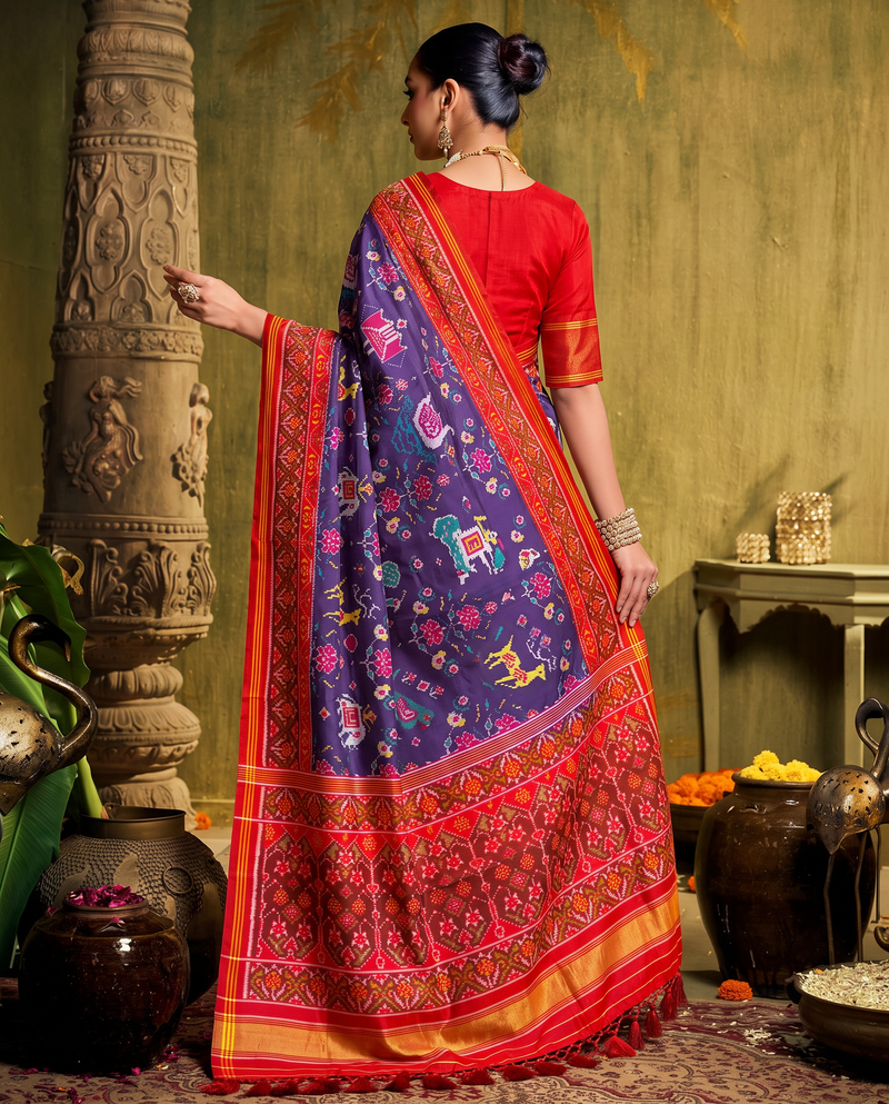 A navy night garden of elephants, peacocks and leaping deer, closing in a glow of gold. Silk Mark certified handloom Patola from Gujarat.