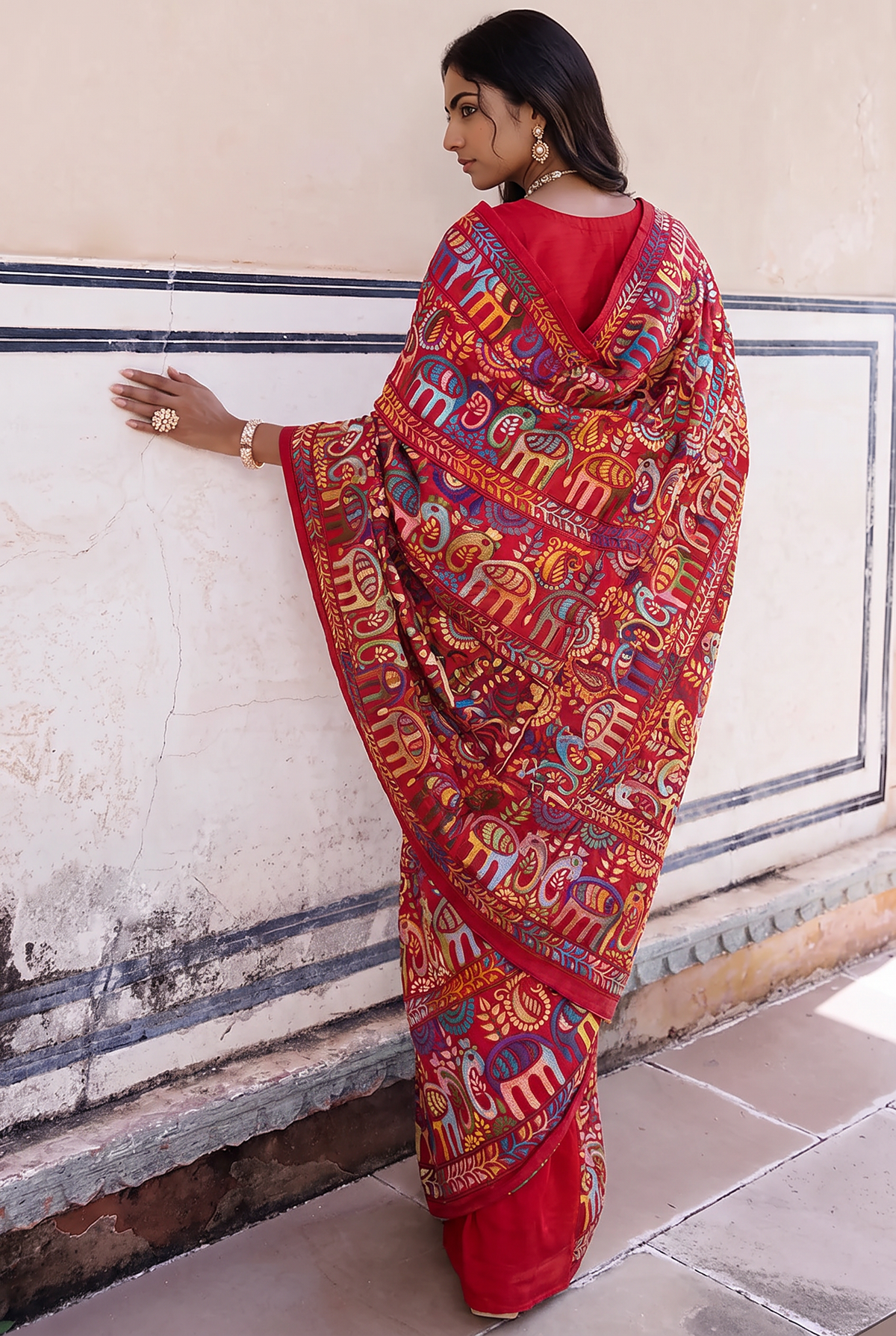 A festival stitched in silk. Elephants march, peacocks perch and paisleys blossom among winding vines, each one hand-worked in vibrant Kantha on pure Bangalore silk