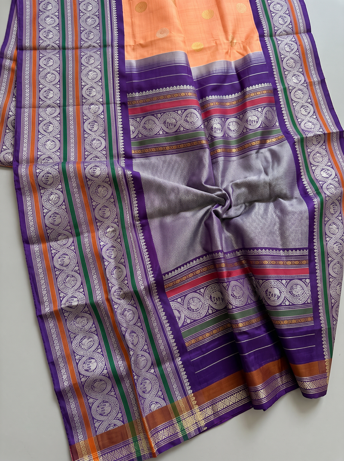 Peach sunrise, violet dusk, silver moons. Handloom Gadwal silk.