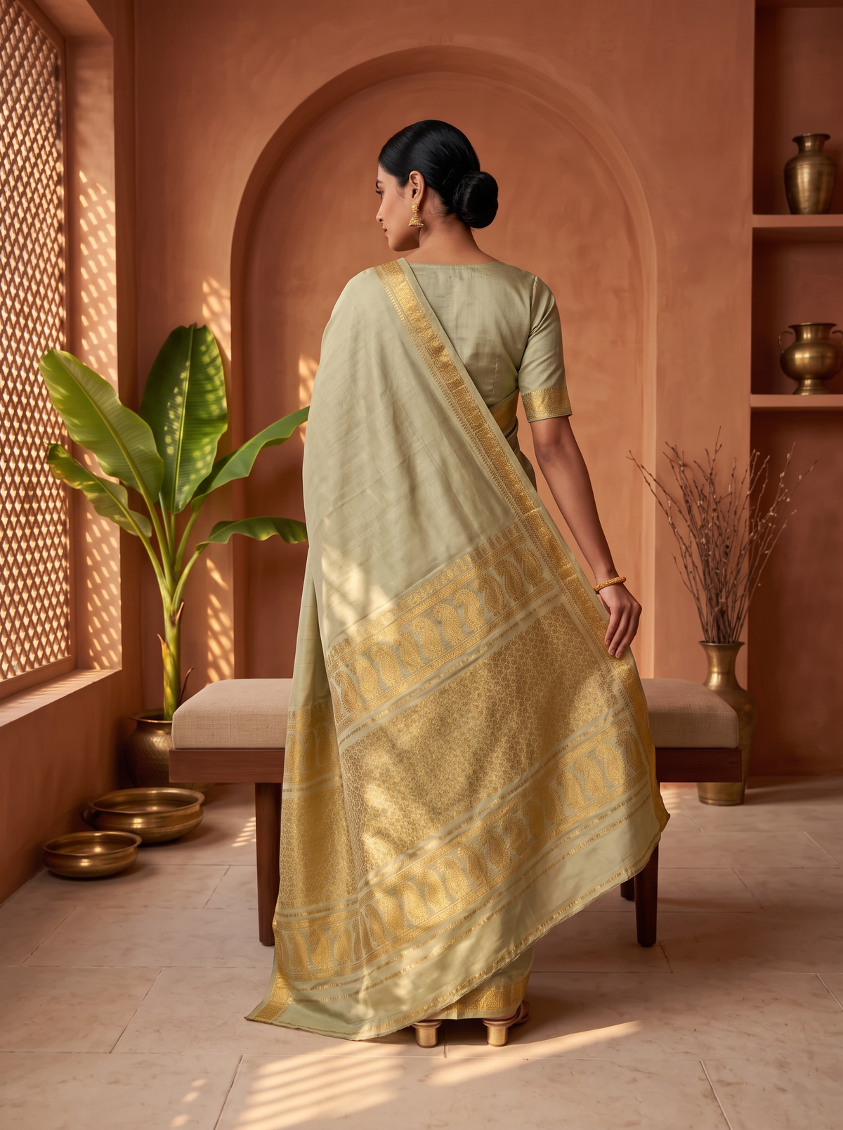 Quiet olive, glorious gold. A pure silk Gadwal with delicate zari borders and a richly woven pallu. Silk Mark certified.