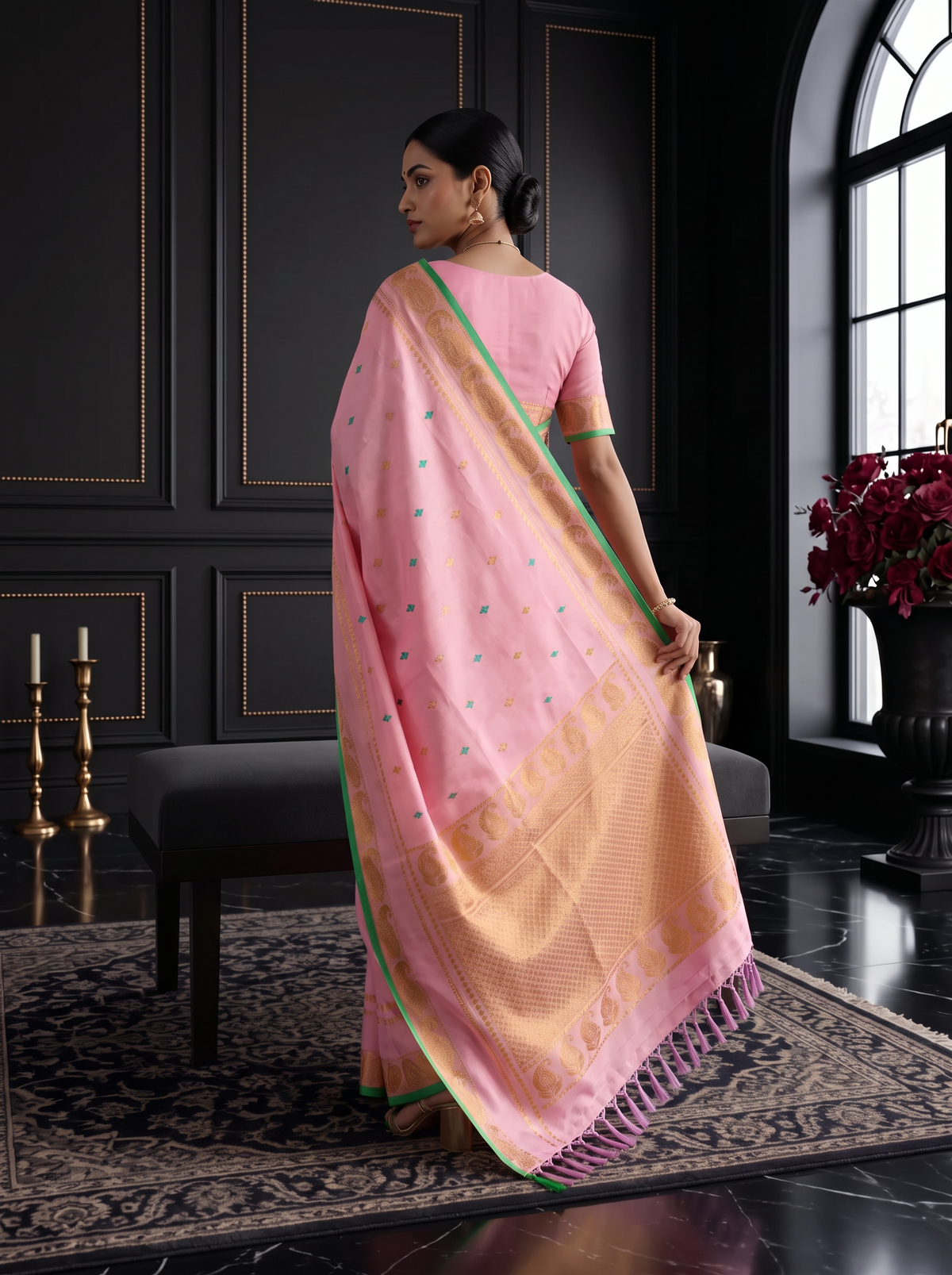 A blush of pink, a sprinkle of gold and teal, and peacocks in shimmering zari dancing along a green edge. Pure silk Gadwal, handwoven with love in Telangana.