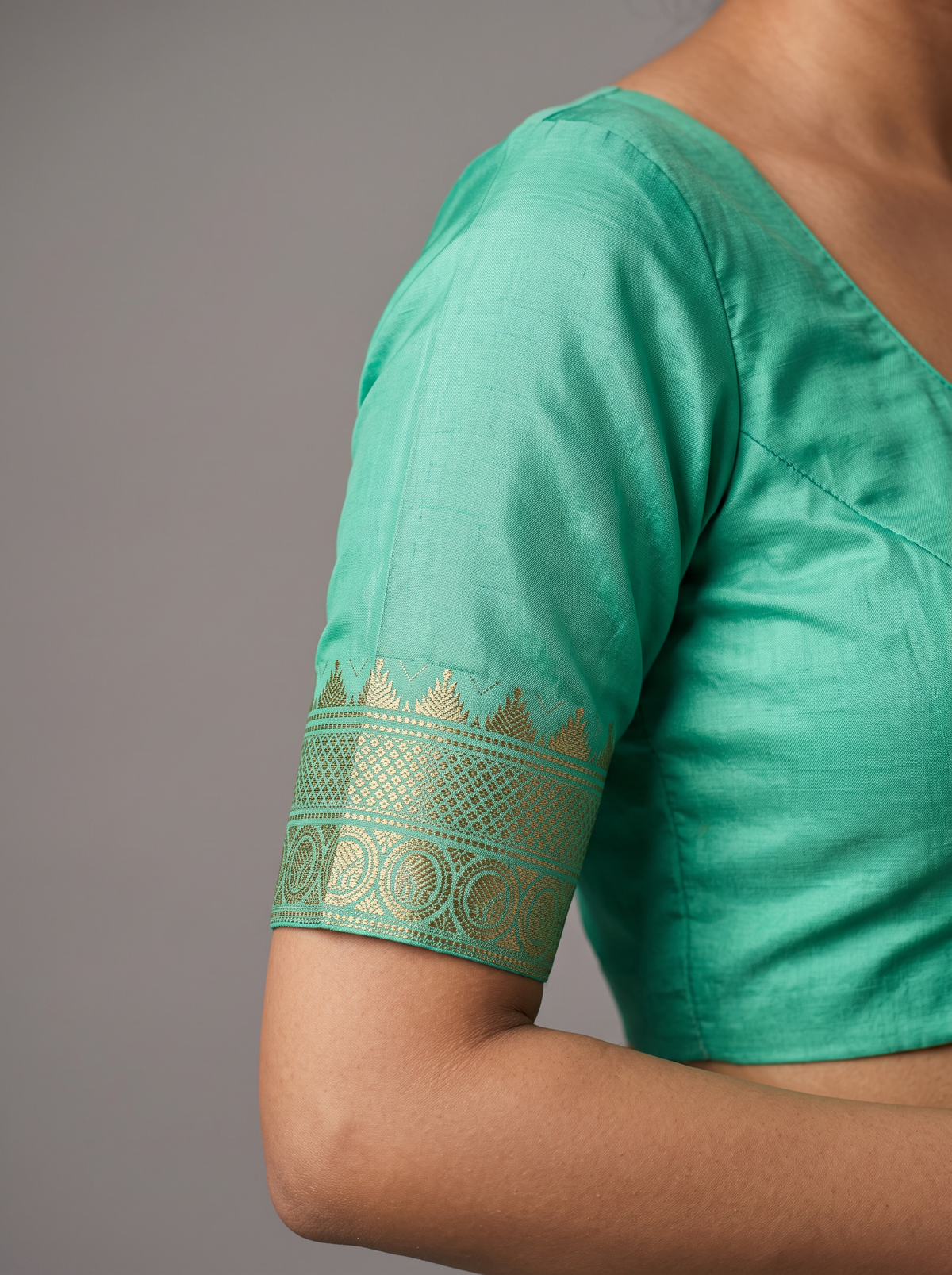 Serene green handloom Gadwal silk, sprinkled with gold and silver butis like stars on a quiet evening.