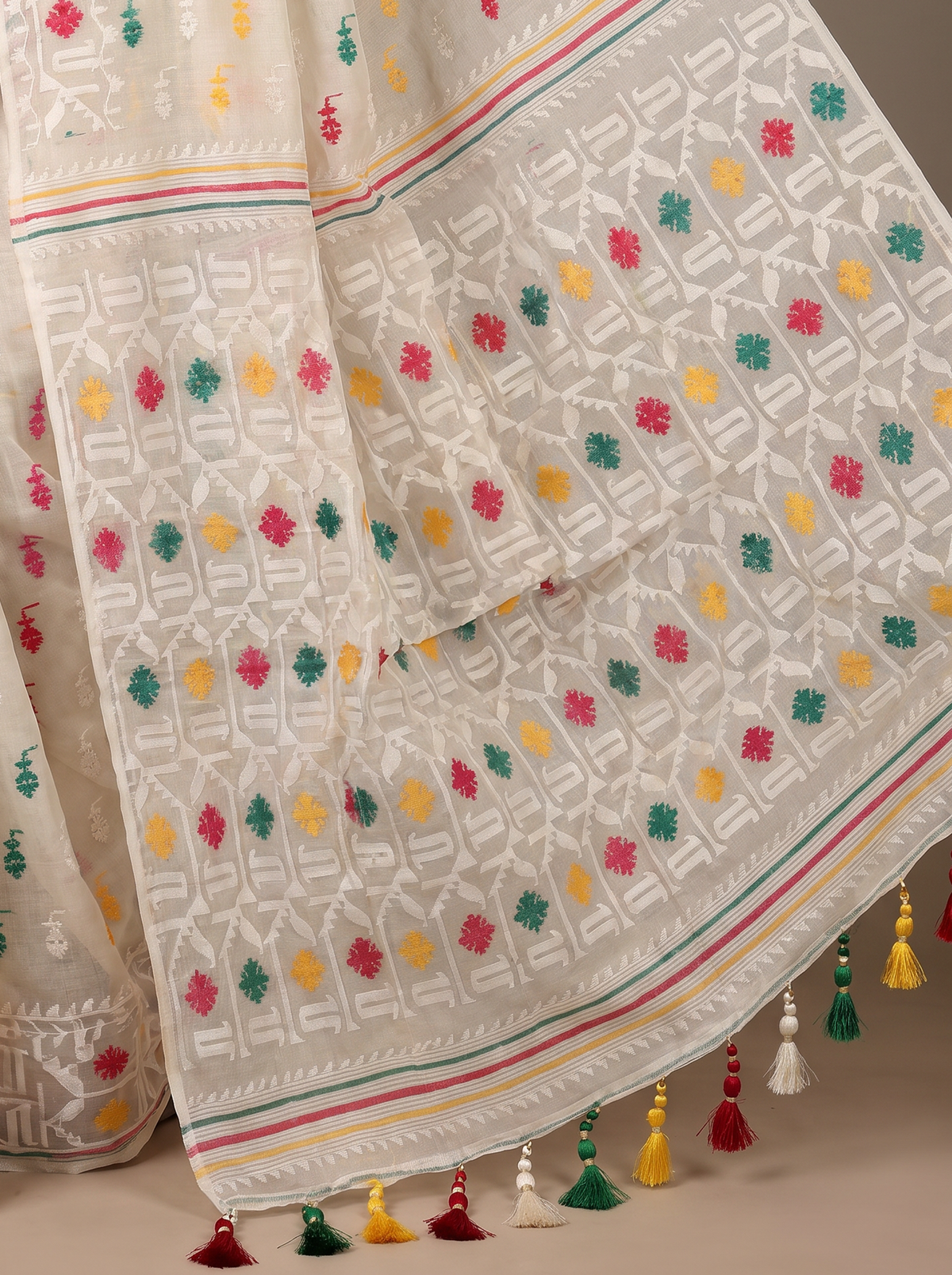 Ivory White Dhakai Jamdani adorned with vibrant Red, Green, and Yellow motifs, delicate white weaving, and subtle multicolored striped accents.