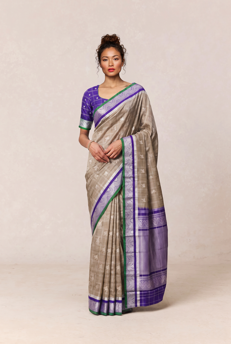 Warm beige, silver creatures, royal purple. Silk Mark certified handloom Gadwal silk.