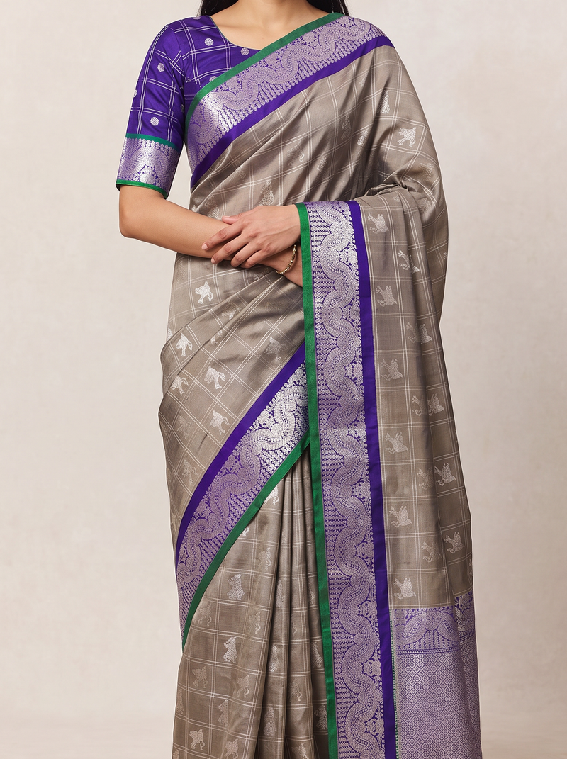 Warm beige, silver creatures, royal purple. Silk Mark certified handloom Gadwal silk.