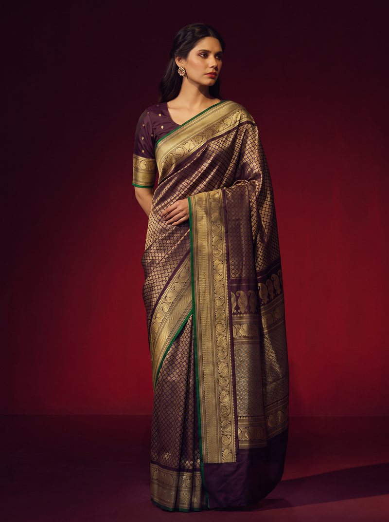 Earth on one side, ocean on the other, crowned in aubergine and gold. Handloom Gadwal silk.