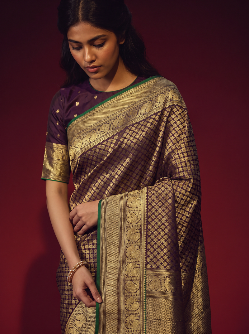 Earth on one side, ocean on the other, crowned in aubergine and gold. Handloom Gadwal silk.