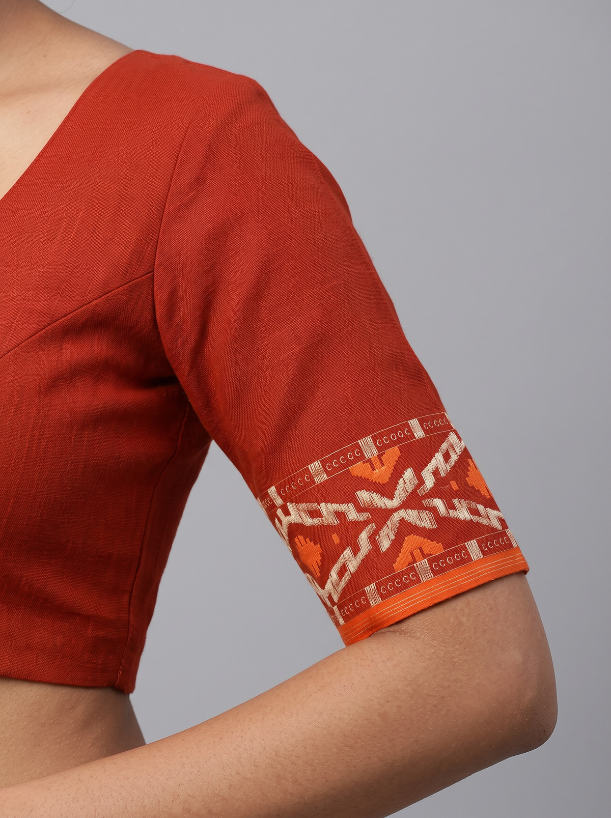 A Timeless Celebration of Dhakai Jamdani — Rich Burnt Rust Illuminated with Silver Zari & Warm Orange Accents
