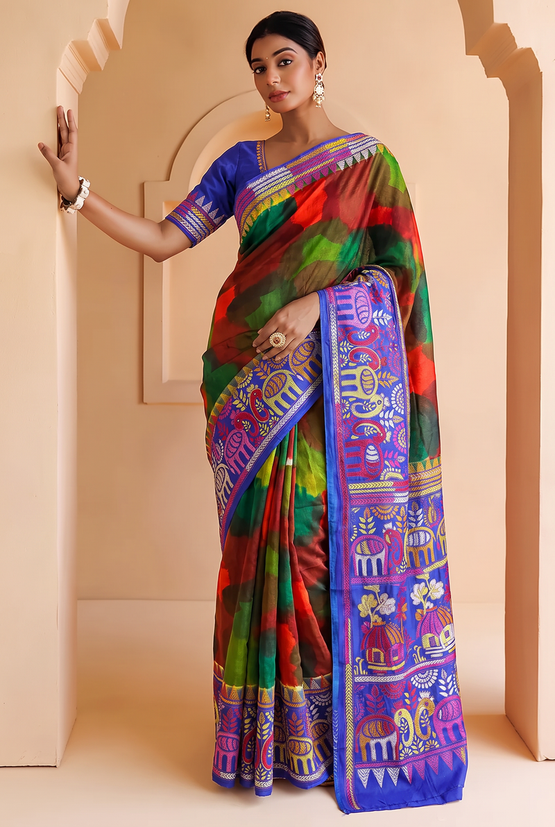Royal blue silk carrying a love story in every stitch. Elephants sway, peacocks dance and palanquins drift home, until the pallu blushes into a hand-painted wash of red, green and blue.