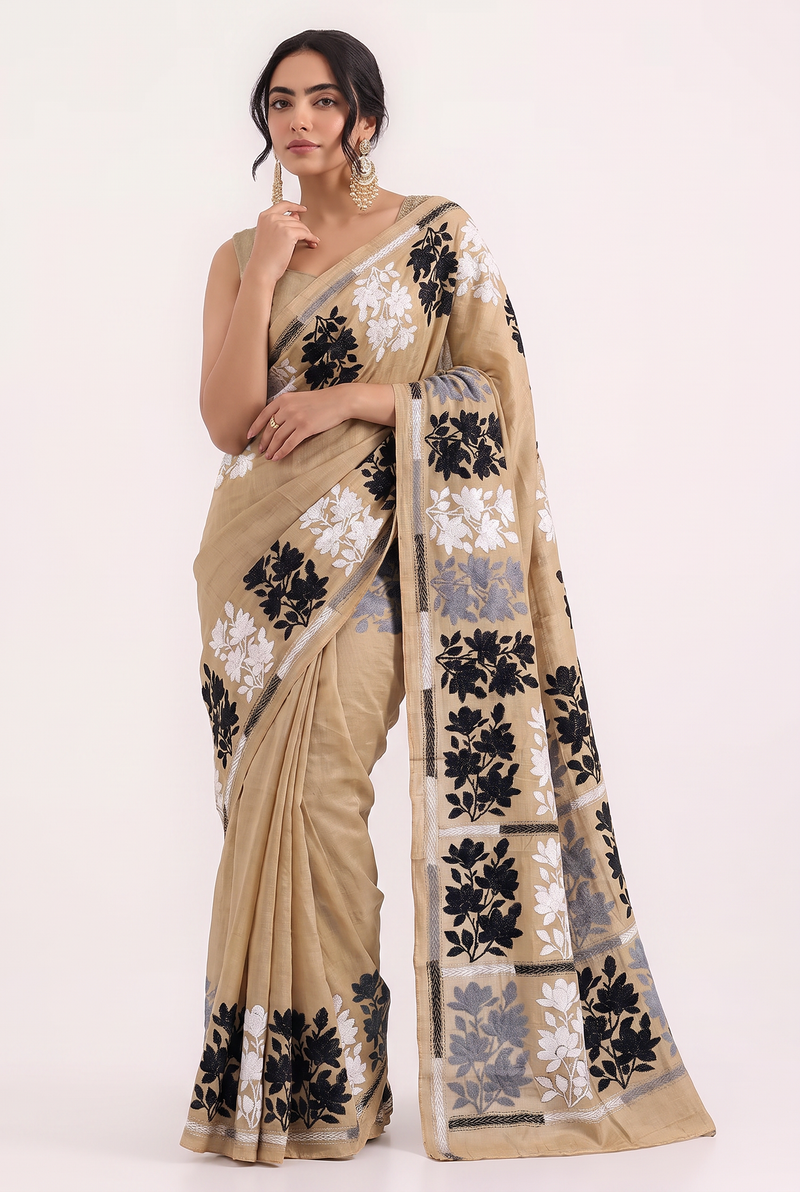 Golden silk and monochrome blooms, drifting from end to end like an ink painting come to life. Handcrafted Gachi Tussar Kantha.