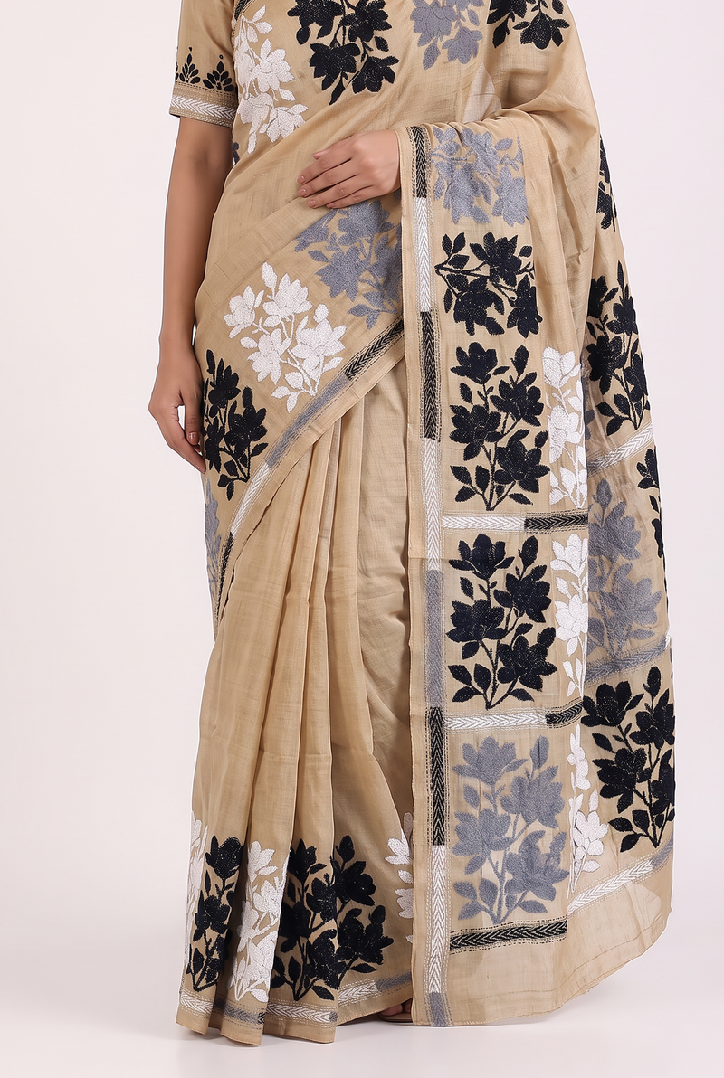 Golden silk and monochrome blooms, drifting from end to end like an ink painting come to life. Handcrafted Gachi Tussar Kantha.