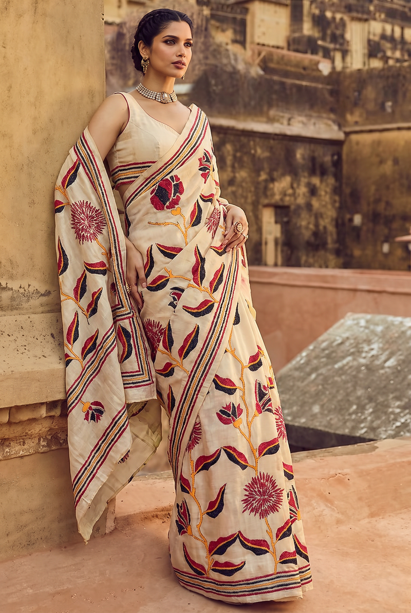 Ivory silk, wild handcrafted Kantha blooms, a striped frame. Silk Mark certified Gachi Tussar.