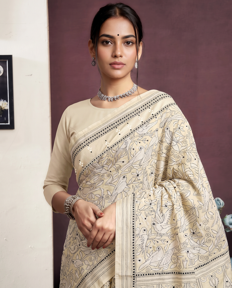 Ivory on ivory, birds in bloom, a scalloped sigh. Handcrafted Kantha from Bolpur.