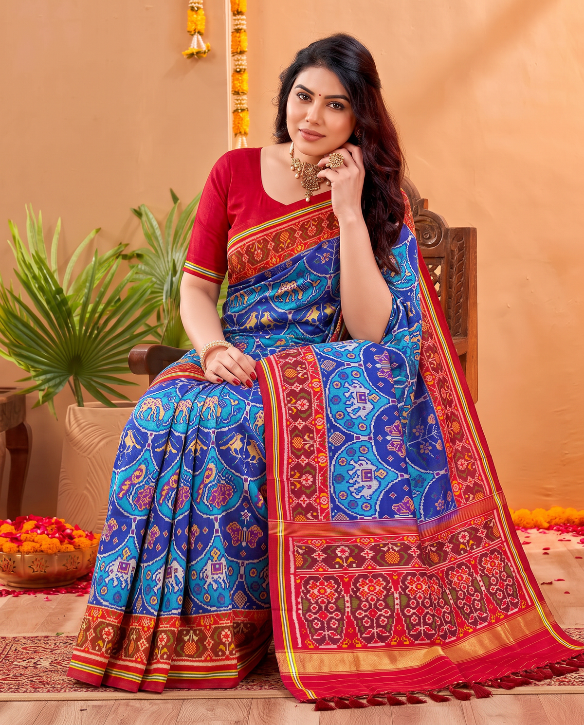An indigo sky of golden elephants and purple paisleys, fading into a maroon and gold farewell. Silk Mark certified handloom Patola from Gujarat.