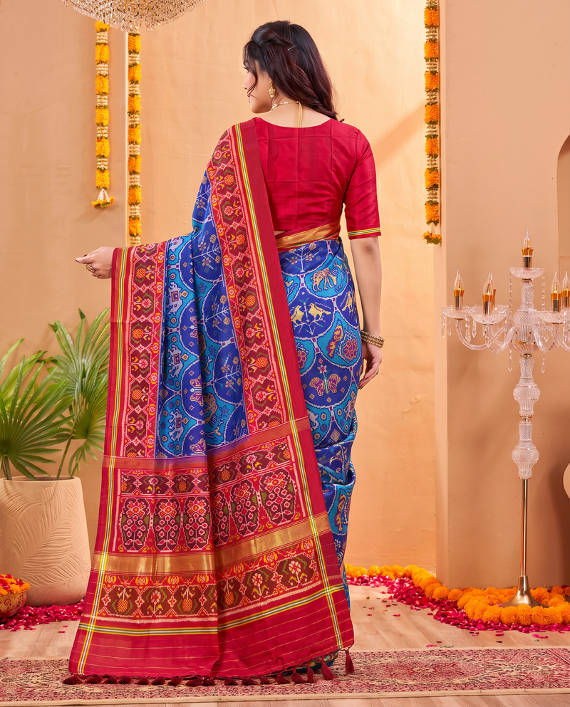 An indigo sky of golden elephants and purple paisleys, fading into a maroon and gold farewell. Silk Mark certified handloom Patola from Gujarat.