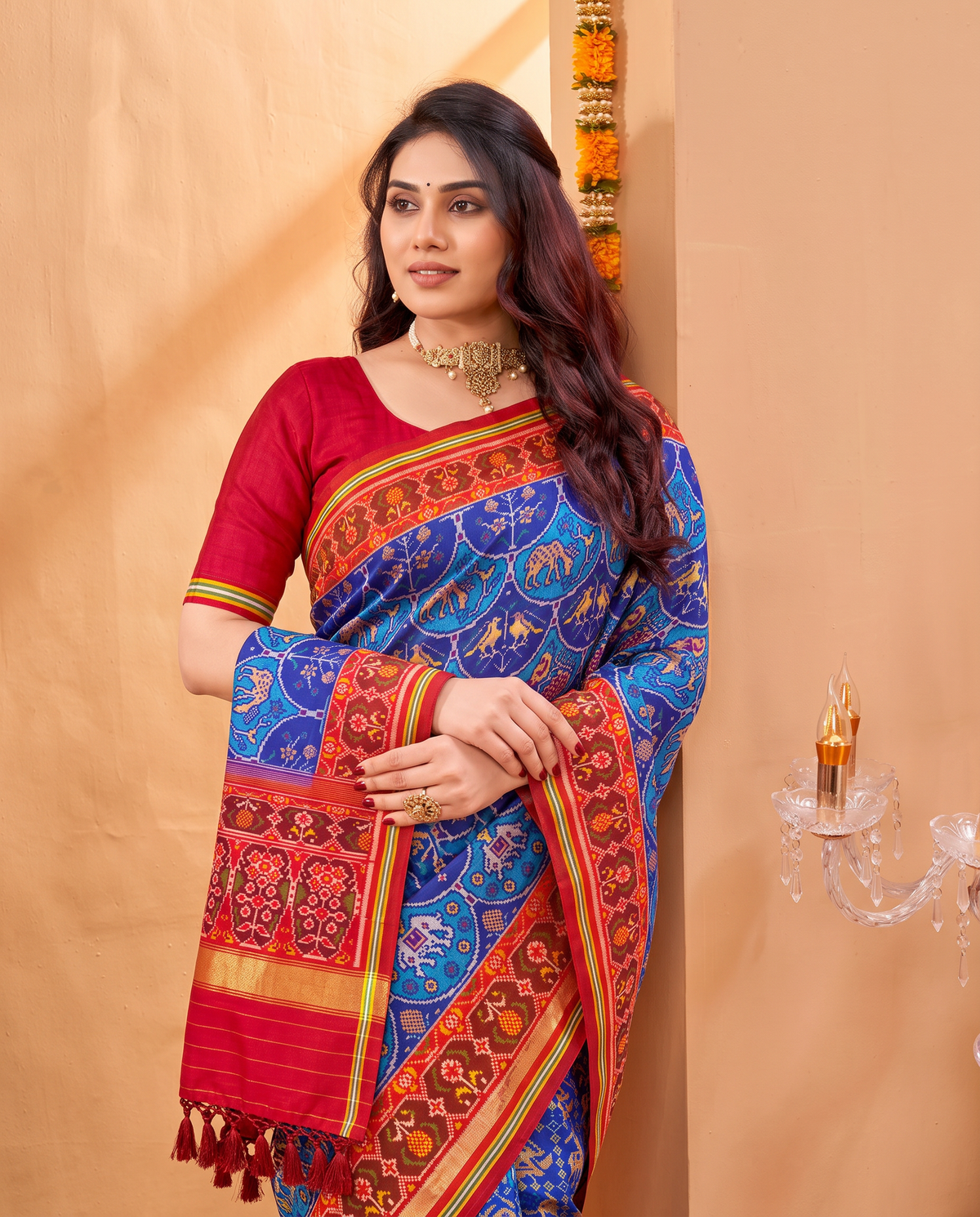 An indigo sky of golden elephants and purple paisleys, fading into a maroon and gold farewell. Silk Mark certified handloom Patola from Gujarat.
