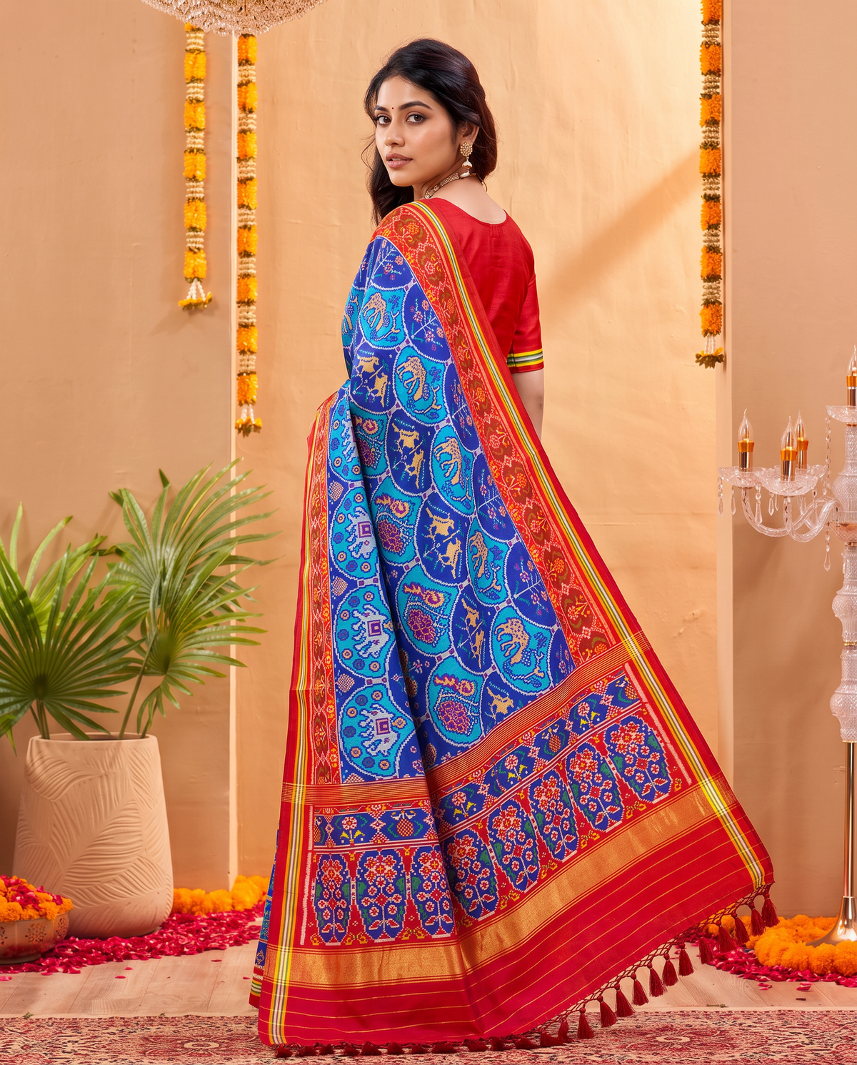 An indigo sky of golden elephants and purple paisleys, fading into a maroon and gold farewell. Silk Mark certified handloom Patola from Gujarat.