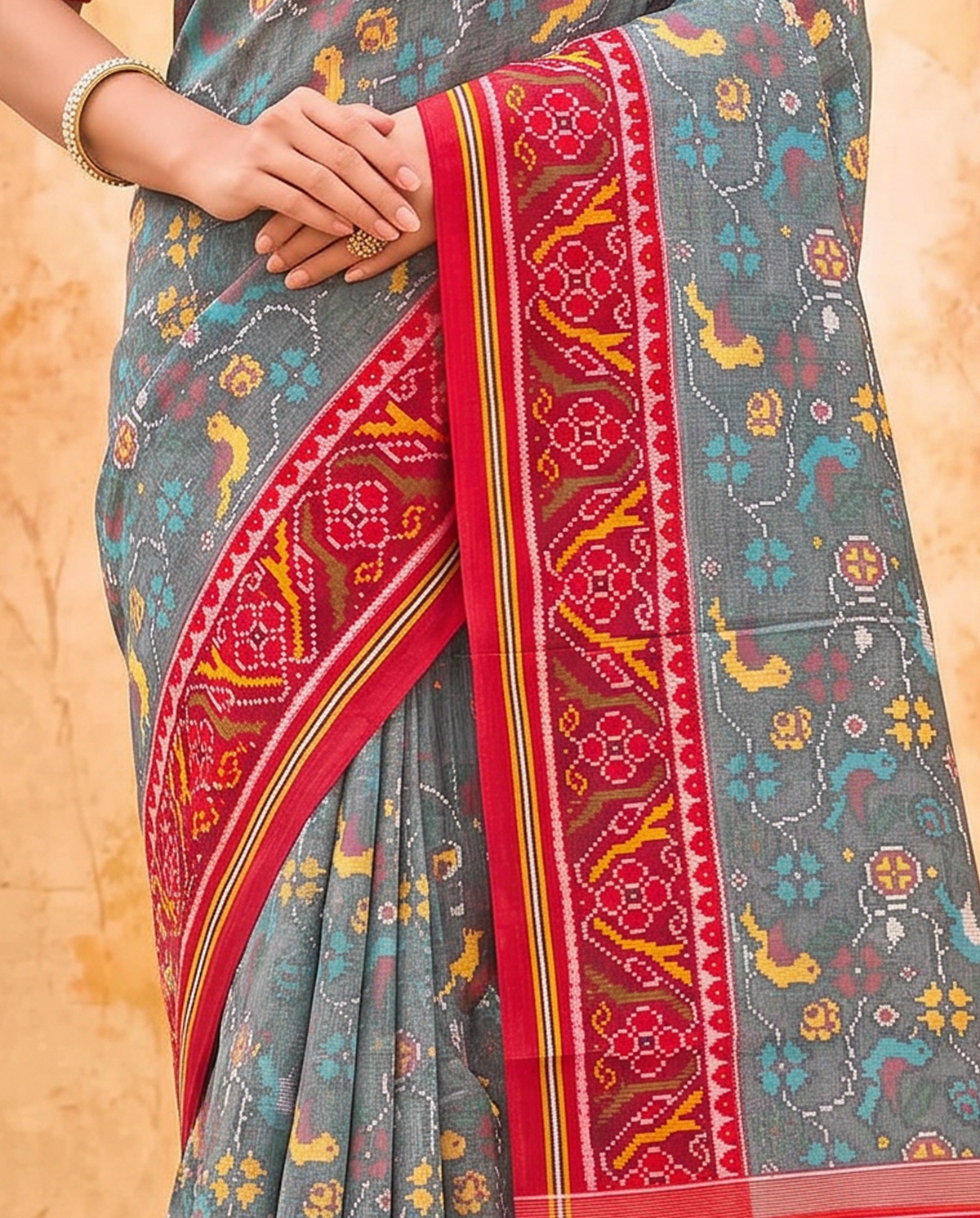Birds in flight across a grey morning sky, closing in maroon and gold. Silk Mark certified handloom Patola from Gujarat.