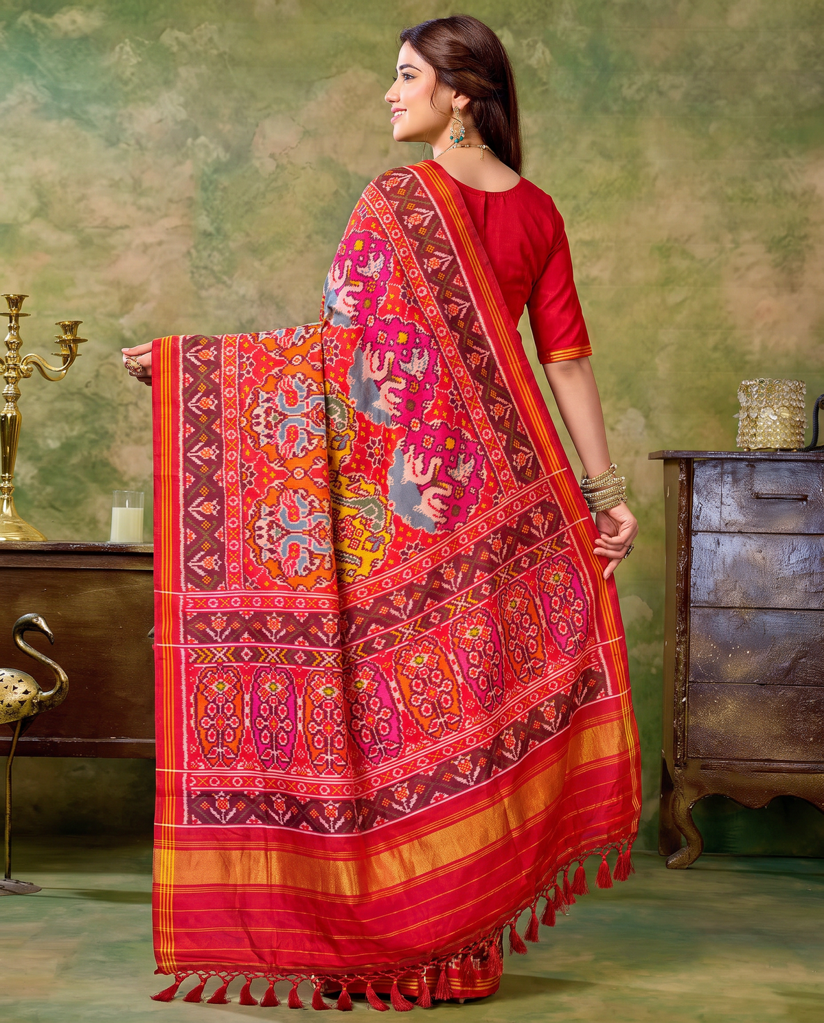 Birds in circles of colour, woven in red. Handloom Rajkot Patola from Gujarat.