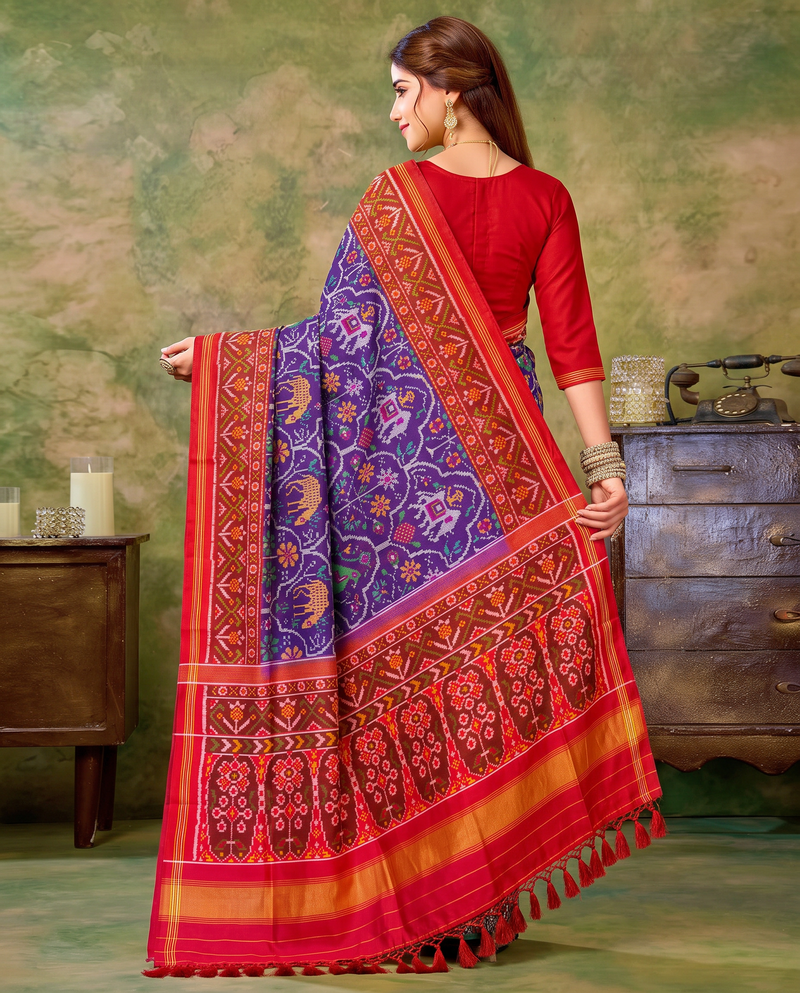 A royal purple procession of golden elephants and green parrots, closing in a glow of gold. Handloom Patola from Gujarat.