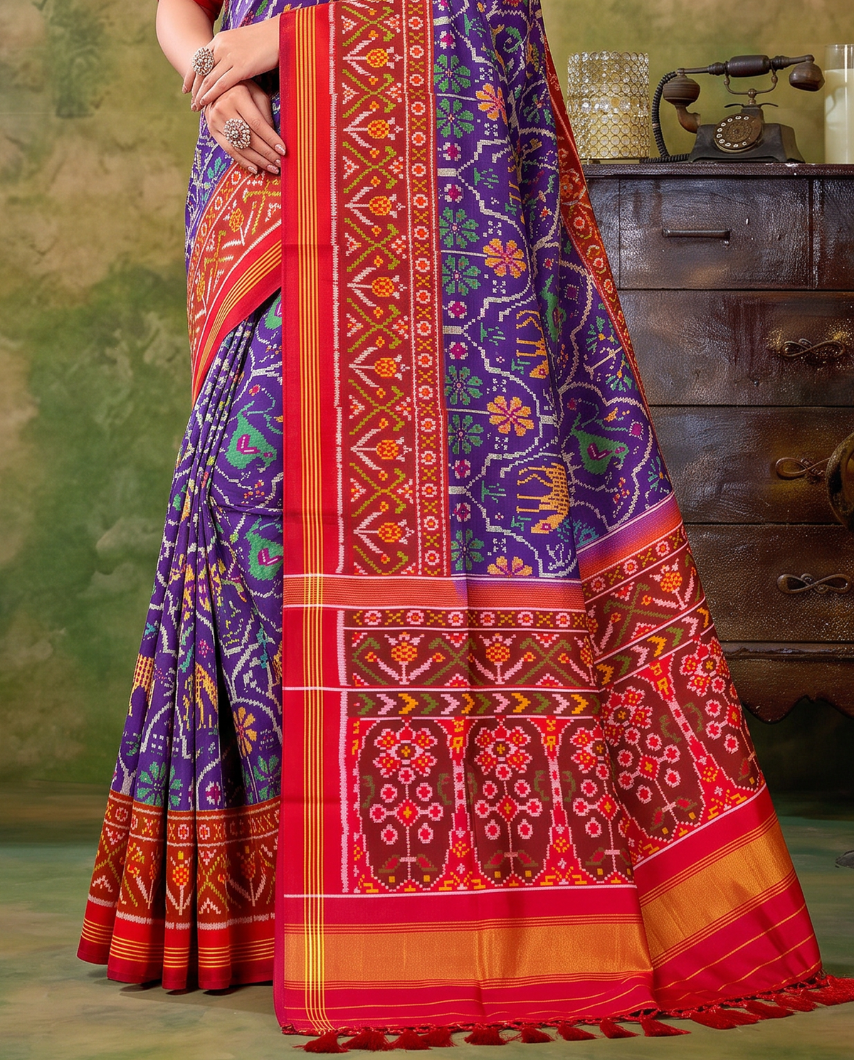 A royal purple procession of golden elephants and green parrots, closing in a glow of gold. Handloom Patola from Gujarat.