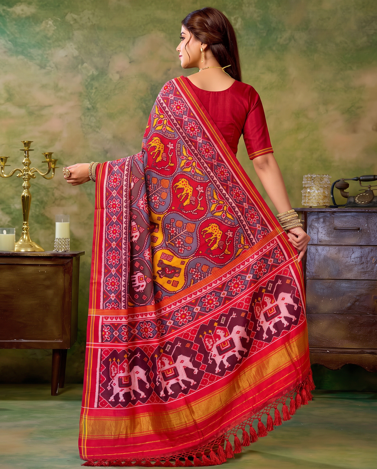 Flowering trees in painted pots, a royal elephant parade, a golden farewell. Handloom Rajkot Patola from Gujarat.